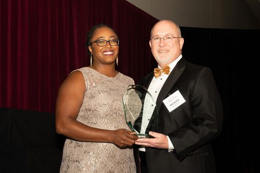 Dean Michael Hartline presents Christina Lynch with the 2022 College of Business Recent Alumni Achievement Award during a ceremony Oct. 13, 2022, at the FSU Student Union.