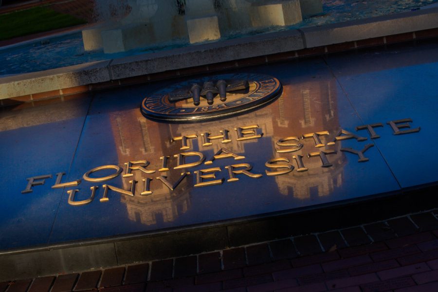 The top of the Westcott Building reflects off the FSU seal and lettering in front of Westcott Fountain. (FSU Photography Services/Bruce Palmer)