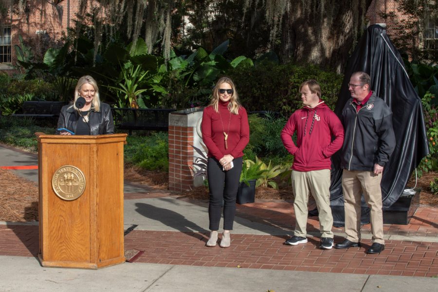 Jennifer Jordan, FSU President Emeritus John Thrasher's eldest daughter, addresses attendees at the dedication ceremony for her father's statue on Saturday, Nov. 19, 2022. (FSU Photography Services)