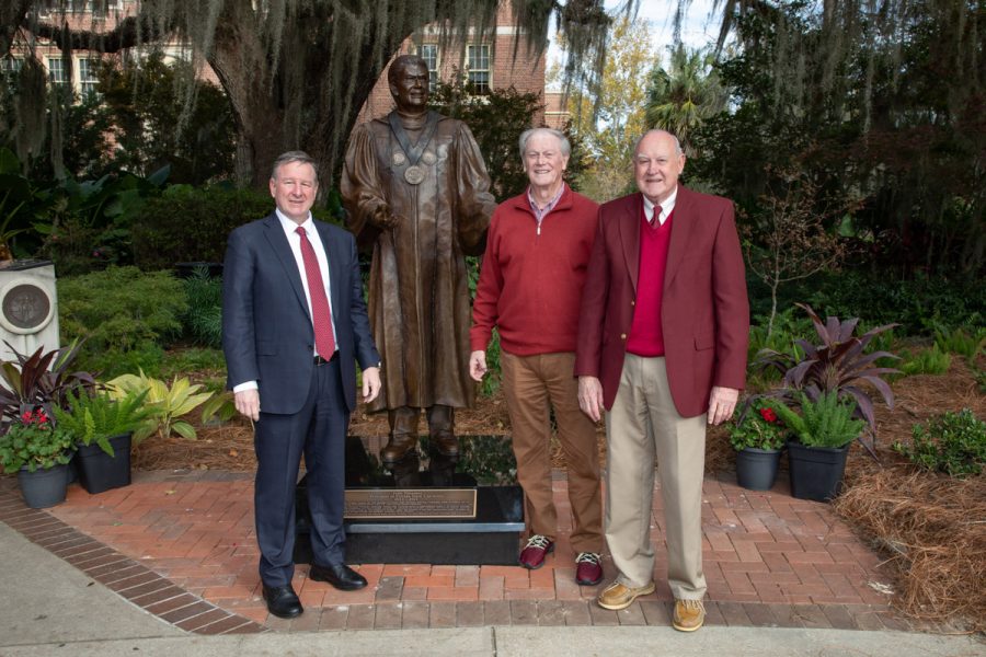 President Richard McCullough, President Emeritus John Thrasher and President Emeritus Dale Lick pose following the dedication ceremony of Thrasher's statue on Saturday, Nov. 19, 2022, at Westcott Plaza. (FSU Photography Services)