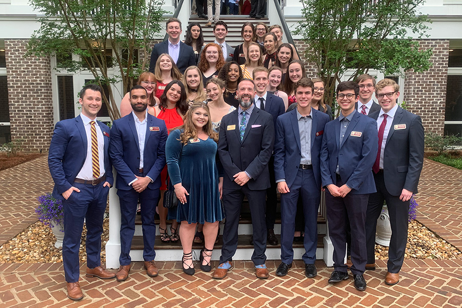 A previous class of Presidential Scholars gathers for a photo at the FSU President’s House. The Presidential Scholars Program is set to grow, with administrators eyeing a goal of doubling in size from 30 per class to 60.