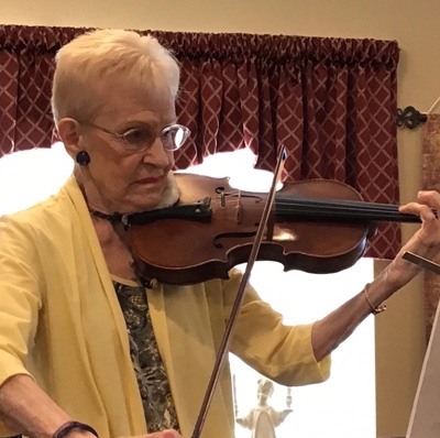 Dorothy Flory Holroyd playing her violin.