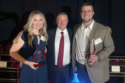 Community Engaged Teaching Award winner Jessica Ridgway-Clayton, an assistant professor in the Jim Moran College of Entrepreneurship, President Richard McCullough, and Distinguished Teaching Award honoree Russell Clayton, associate professor in the School of Communication. 