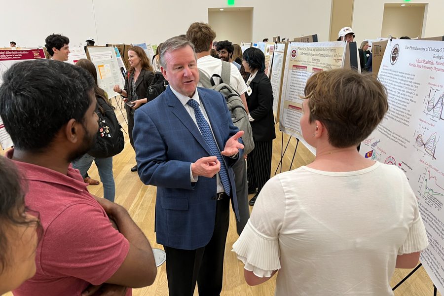 President Richard McCullough visits with student researchers presenting at the 23rd annual Undergraduate Research Symposium in the Student Union ballrooms, April 6, 2023.