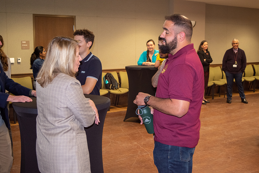 Cindy Green (left), director of the Center for Global Engagement at FSU, speaks with Jorge Galeano-Cabral, an international doctoral student graduating with a degree in mechanical engineering this fall, during the 2023 International Student Graduation Reception. (FSU Center for Global Engagement/Seamus Toner) 