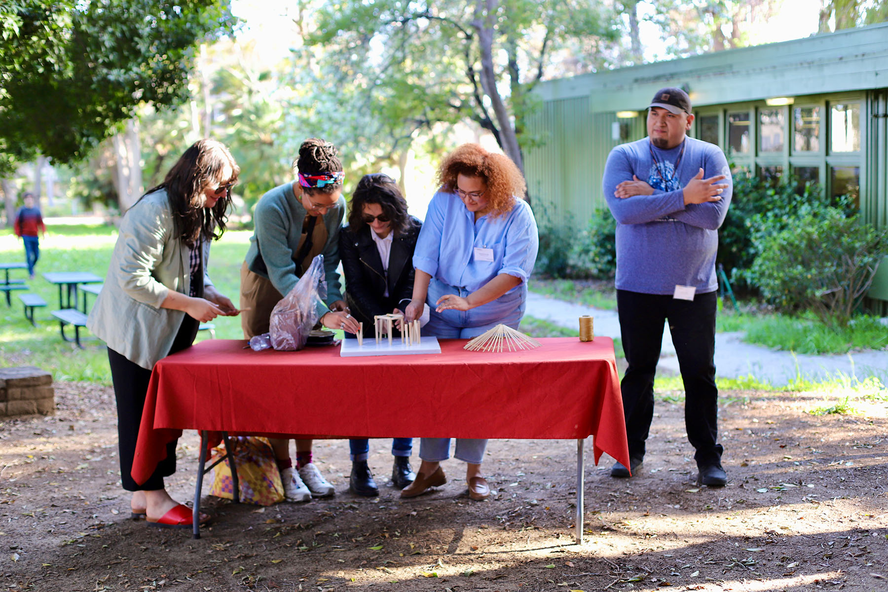 Brenner Billy of the Choctaw Cultural Center directs workshop in how to build a chukka, a traditional Choctaw home