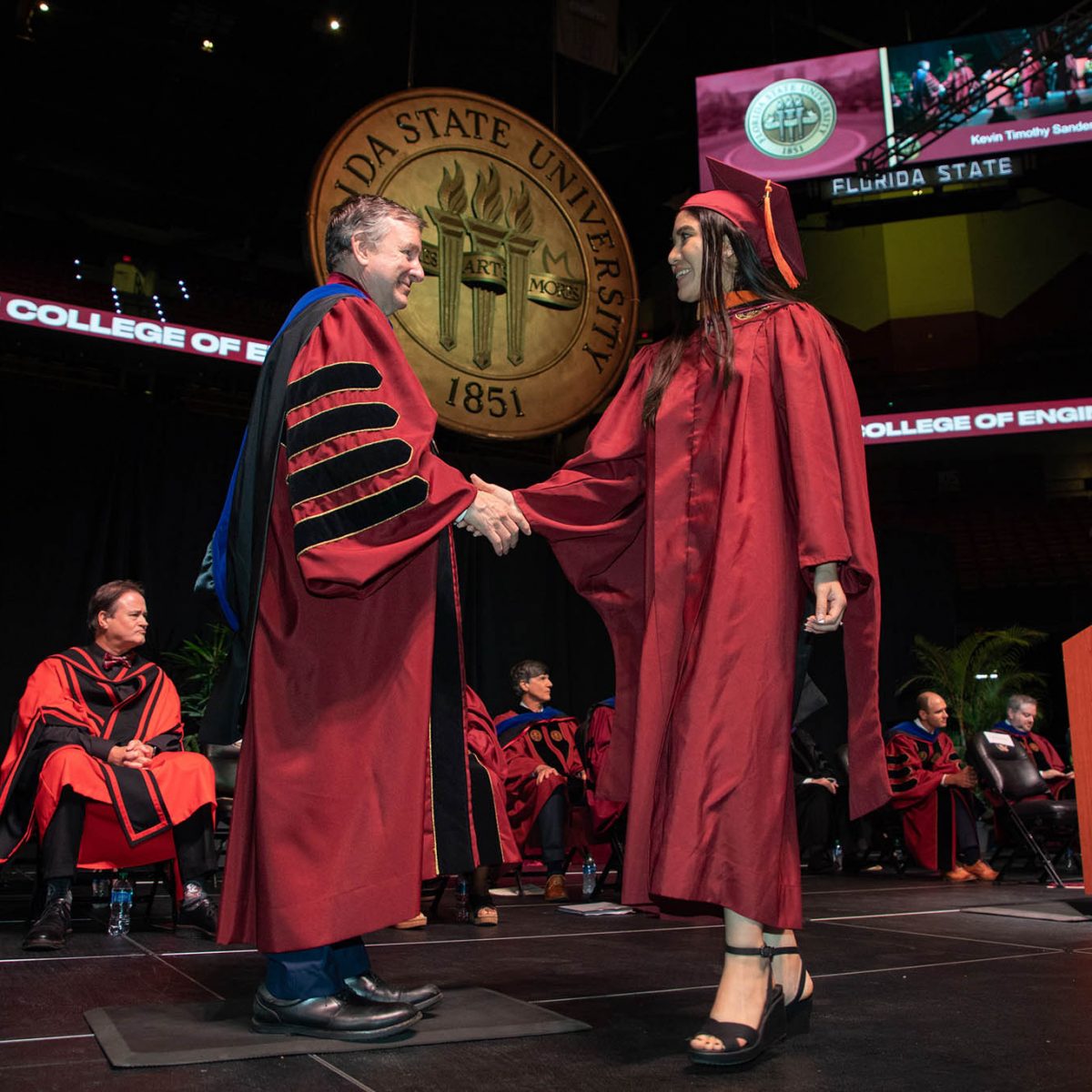 Florida State University President Richard McCullough congratulates a graduate during the summer commencement Friday, Aug. 4, 2023, at the Donald L. Tucker Civic Center. (FSU Photography Services)