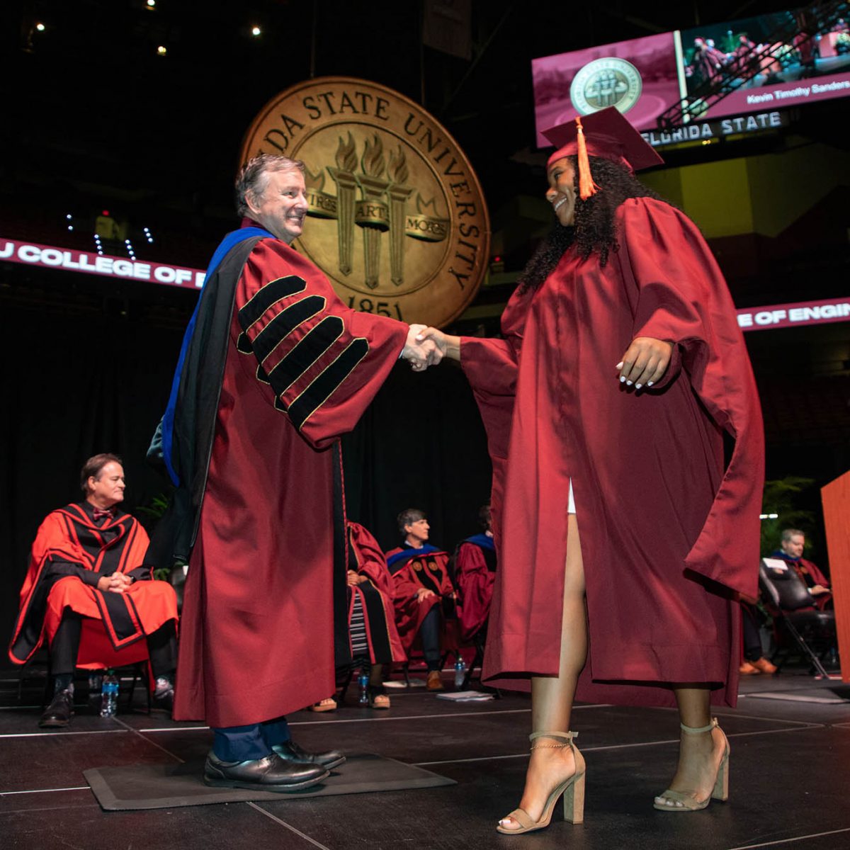 Florida State University President Richard McCullough congratulates a graduate during the summer commencement Friday, Aug. 4, 2023, at the Donald L. Tucker Civic Center. (FSU Photography Services)