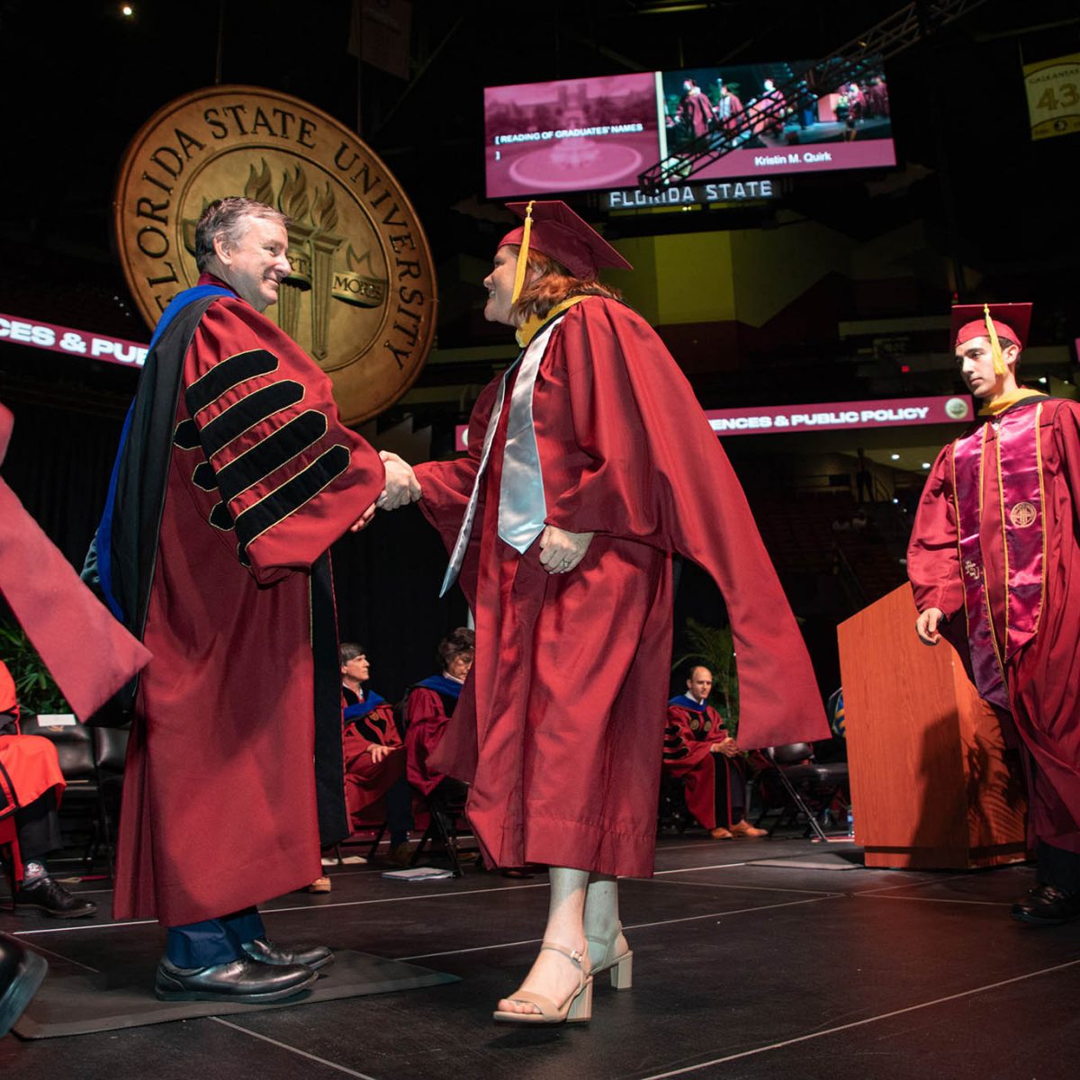 Florida State University President Richard McCullough congratulates a graduate during the summer commencement Friday, Aug. 4, 2023, at the Donald L. Tucker Civic Center. (FSU Photography Services)