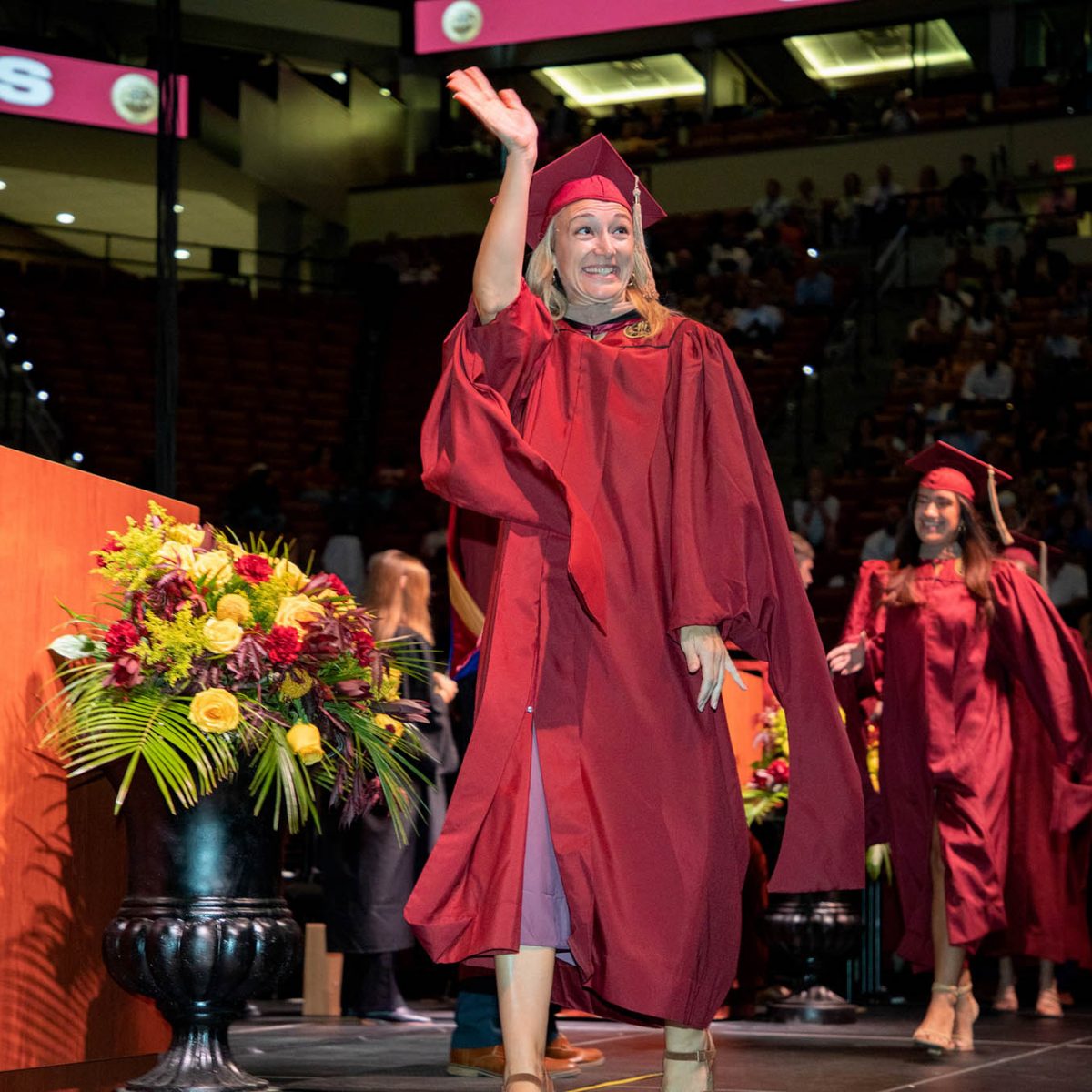 A Florida State University graduate celebrates during summer commencement Friday, Aug. 4, 2023, at the Donald L. Tucker Civic Center. (FSU Photography Services)