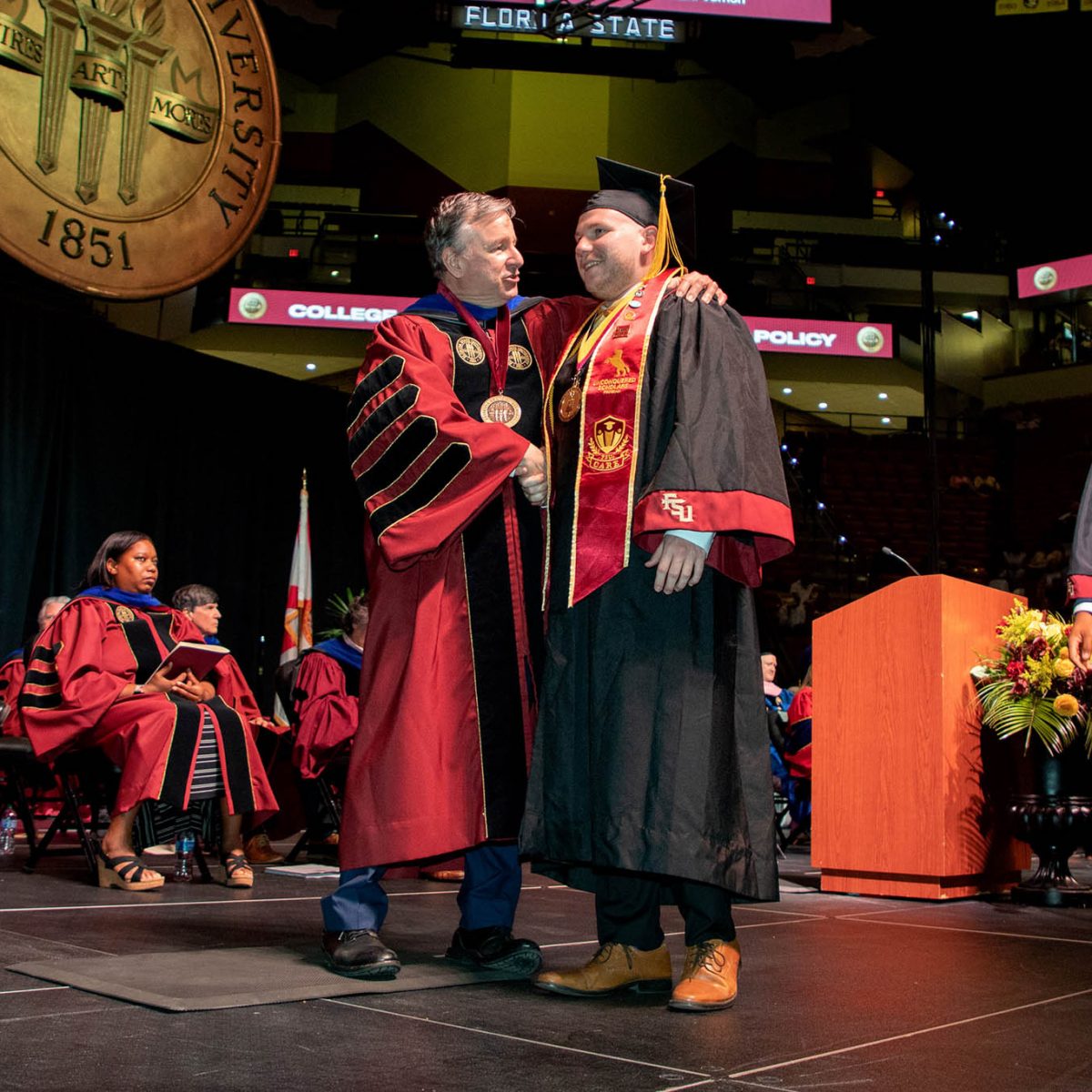 A Florida State University graduate celebrates during summer commencement Friday, Aug. 4, 2023, at the Donald L. Tucker Civic Center. (FSU Photography Services)