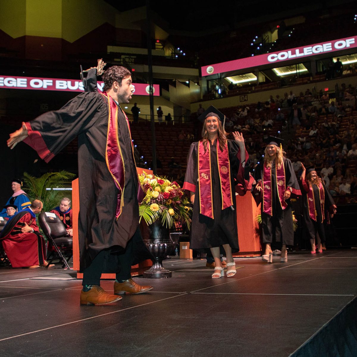 A Florida State University graduate celebrates during summer commencement Friday, Aug. 4, 2023, at the Donald L. Tucker Civic Center. (FSU Photography Services)