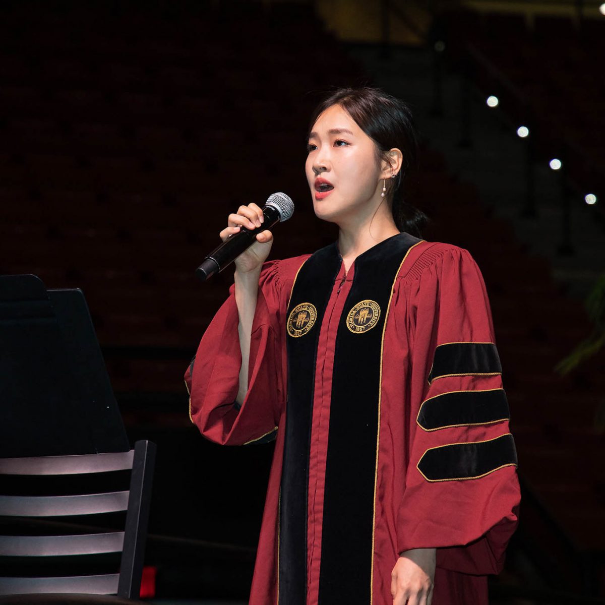 Doctoral student Ye Ji Lee sings the National Anthem during summer commencement Friday, Aug. 4, 2023, at the Donald L. Tucker Civic Center. (FSU Photography Services)