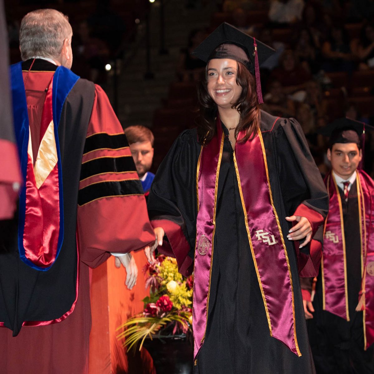 Florida State University President Richard McCullough congratulates a graduate during the summer commencement Friday, Aug. 4, 2023, at the Donald L. Tucker Civic Center. (FSU Photography Services)