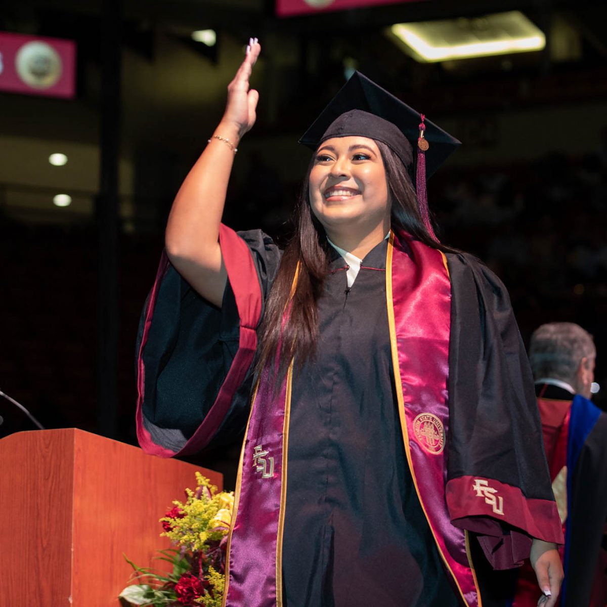 A student celebrates during summer commencement Friday, Aug. 4, 2023, at the Donald L. Tucker Civic Center. (FSU Photography Services)