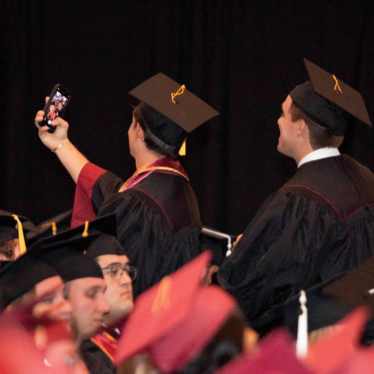 A Florida State University graduate celebrates during summer commencement Friday, Aug. 4, 2023, at the Donald L. Tucker Civic Center. (FSU Photography Services)