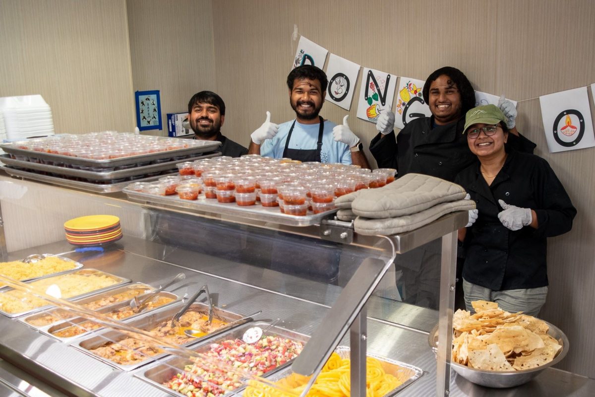 BongoNoles President Sudipto Saha (left) and Cultural Secretary Sanwayee Kundu (right) serve food alongside fellow members during Global Café: Bengali on Friday, Sept. 29. (Seamus Toner, FSU Center for Global Engagement)