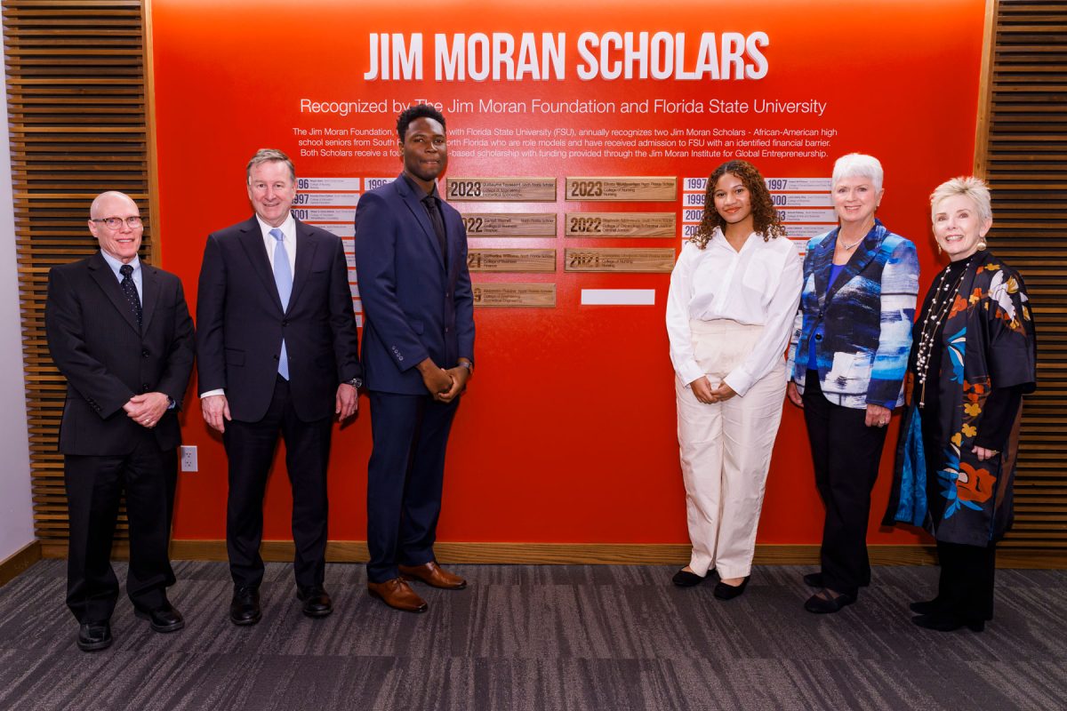 From left: Jim Moran Eminent Scholar in Business Administration Bruce Lamont, FSU President Richard McCullough, South Florida Jim Moran Scholar Guillaume Toussaint, North Florida Jim Moran Scholar Efrata Woldmariam, The Jim Moran Foundation Chairman and President Jan Moran, and Jim Moran College of Entrepreneurship Dean Susan Fiorito. (Photo: Colin Hackley Photography)