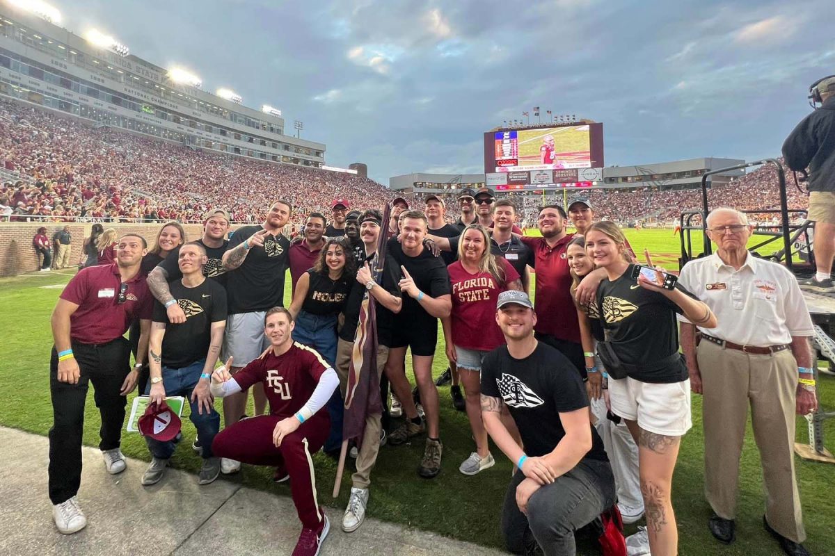 Veterans pose on the field of Doak S. Campbell Stadium during the Military Appreciation Game on Nov. 11, 2023. (FSU Student Veterans Center)