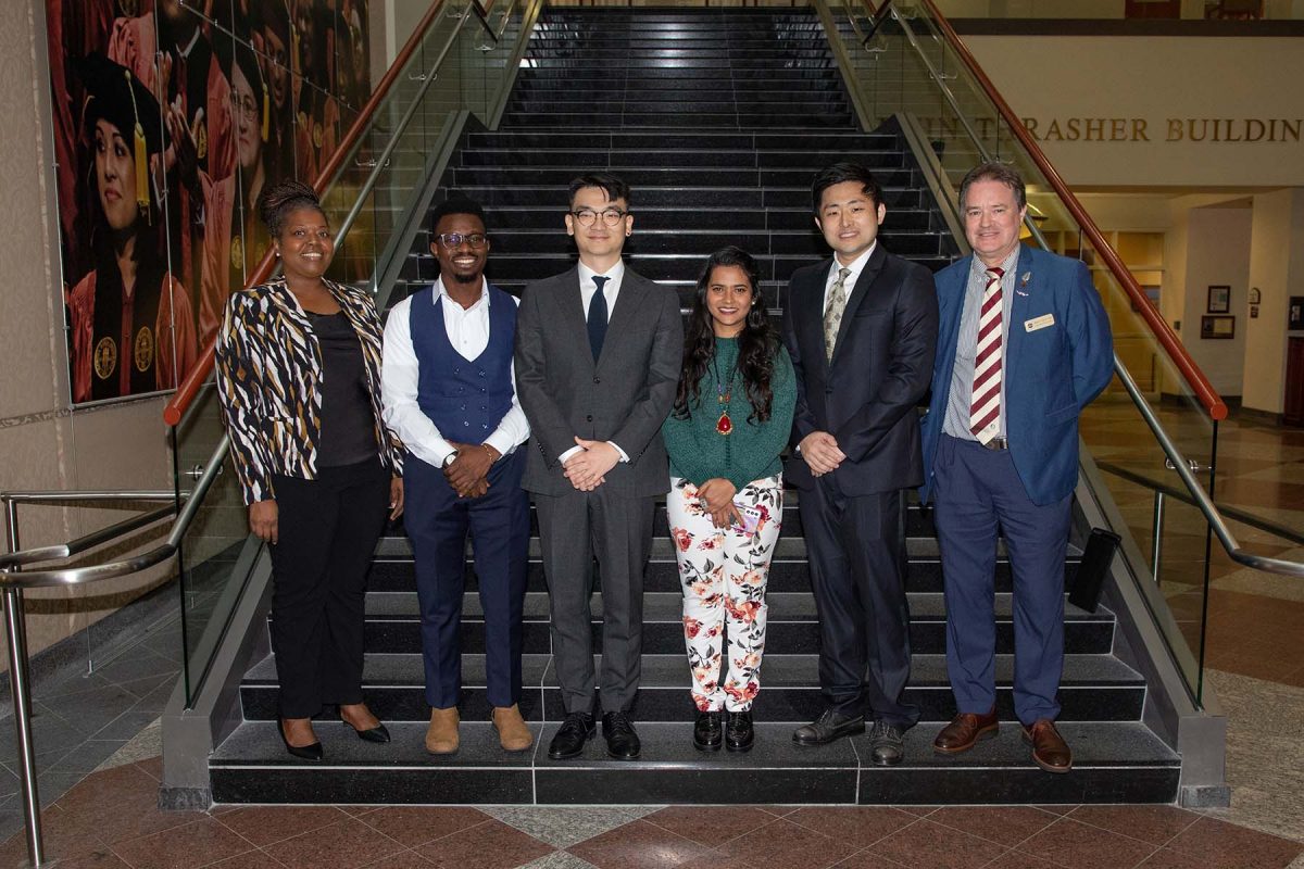 From L to R: Adrienne Stephenson, associate dean of The Graduate School; John Akintola, People's Choice Award winner; Hyosoon Yim, first-place winner; Tania Sultana, second-place winner; Meng Tian, third-place winner; and Mark Riley, dean of the Graduate School. (FSU Photography Services)