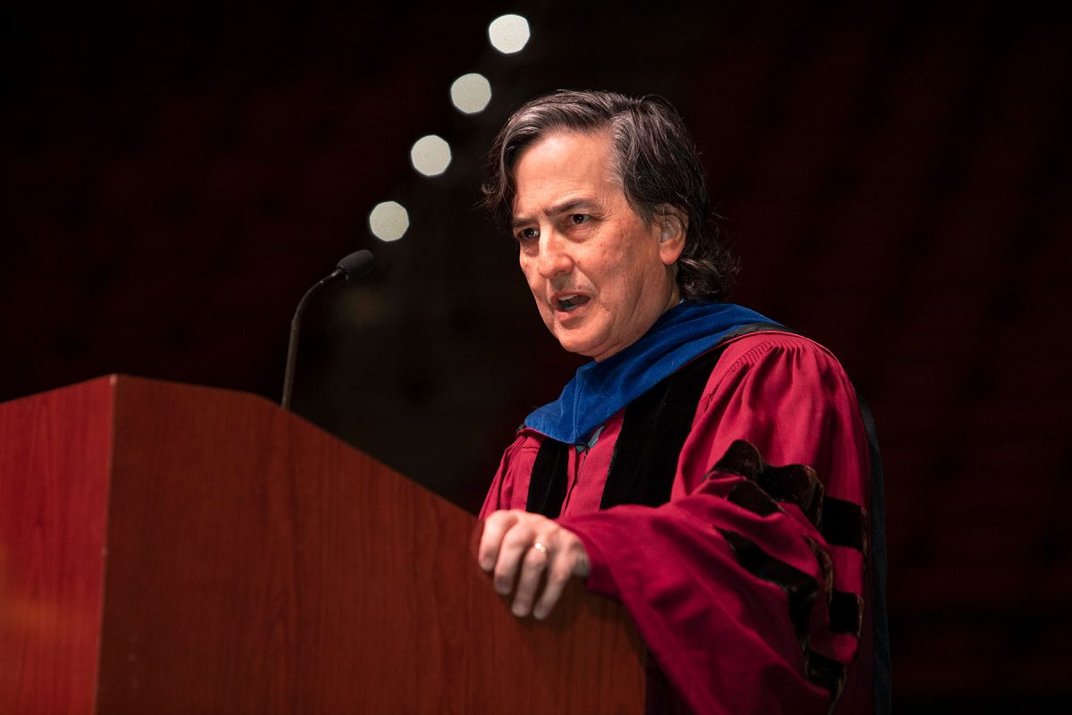 Florida State University Provost Jim Clark congratulates graduates during fall doctoral hooding ceremony Friday, Dec. 15, 2023, at the Donald L. Tucker Civic Center. (FSU Photography Services)