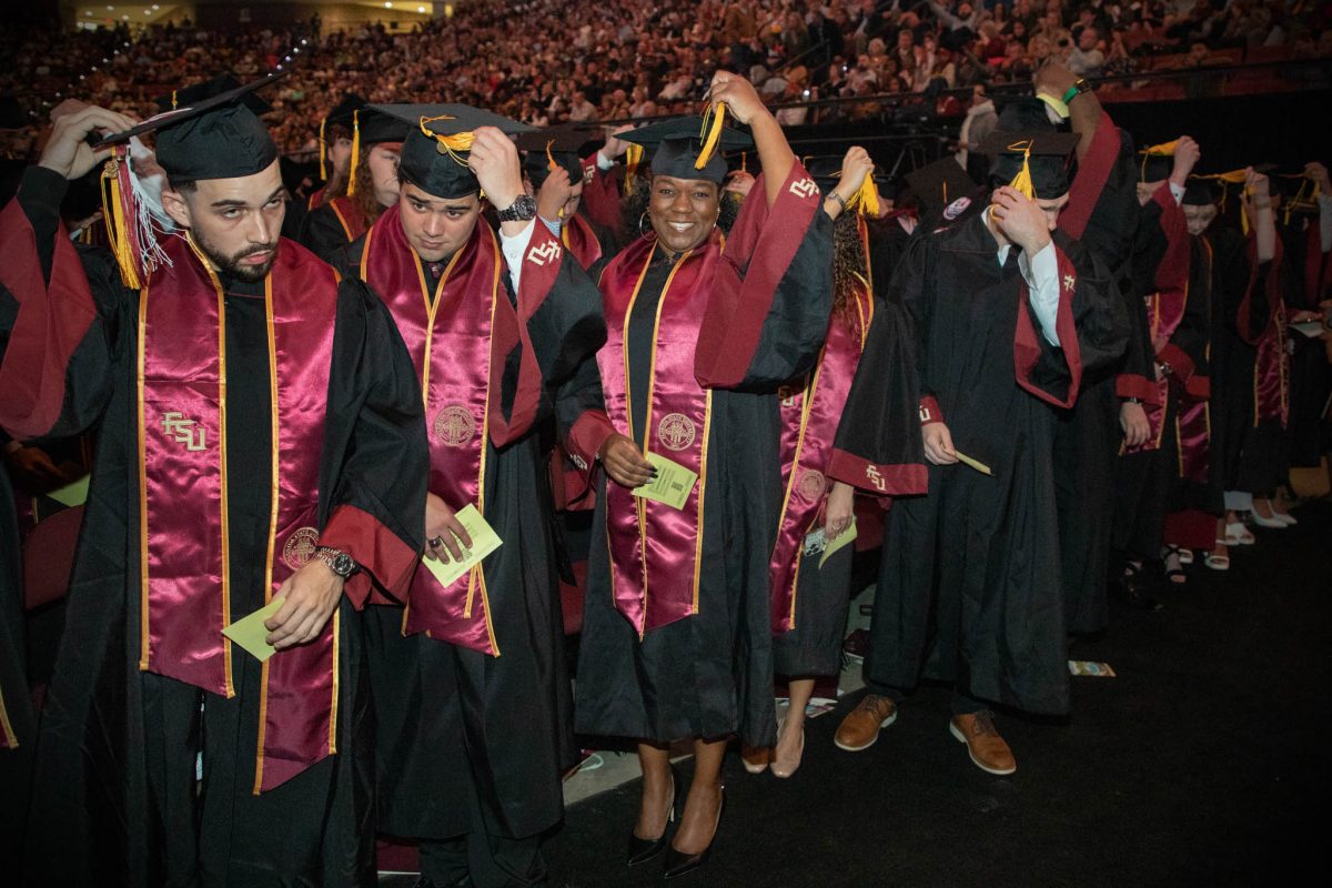 Graduates celebrate during commencement Friday, Dec. 15, 2023, at the Donald L. Tucker Civic Center. (FSU Photography Services)