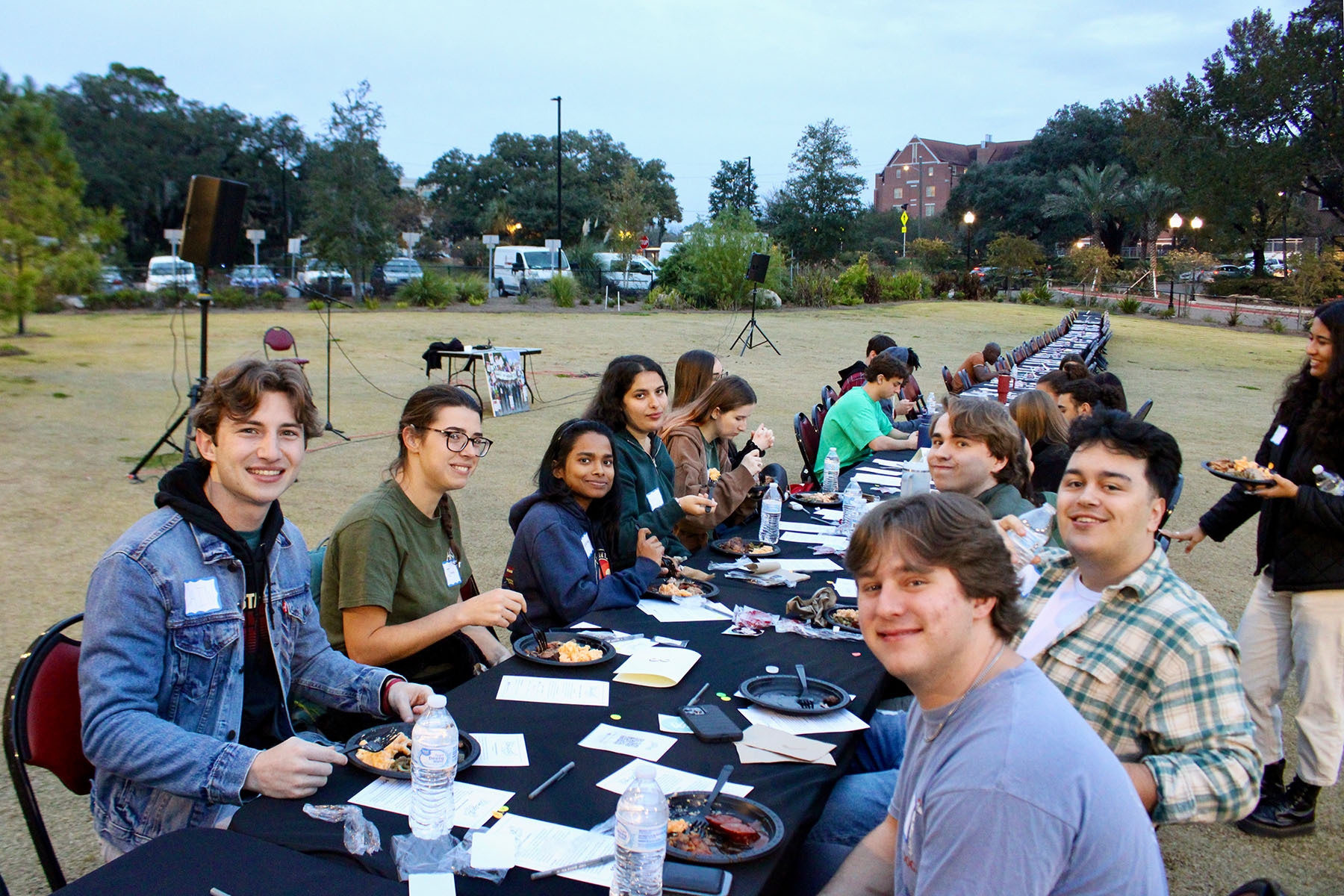 Participants of the "Longest Table" enjoy dinner and discussion Nov. 30, 2023. (Annie Blanchard)