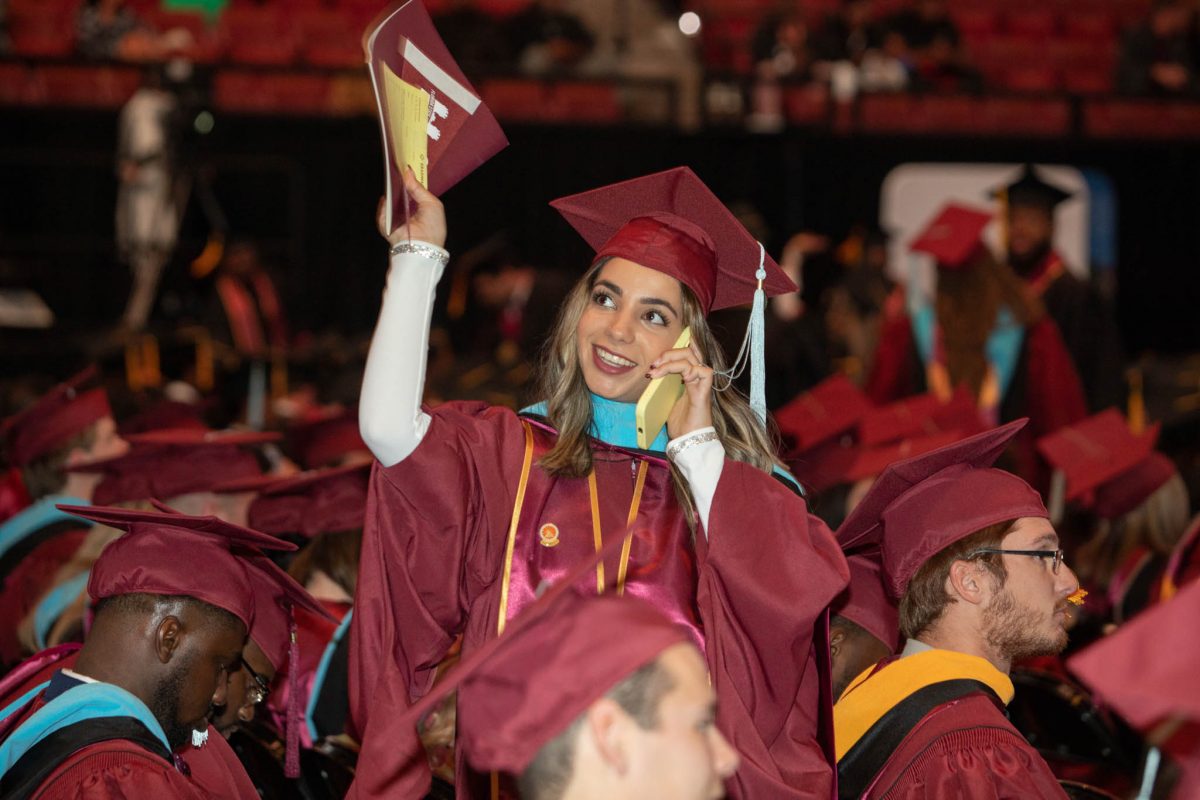 A student celebrates during commencement Friday, Dec. 15, 2023, at the Donald L. Tucker Civic Center. (FSU Photography Services)