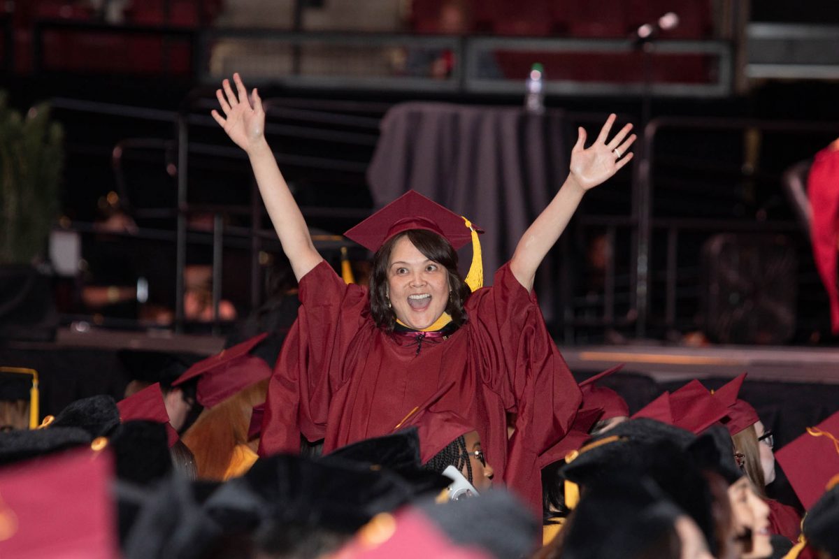 A student celebrates during commencement Friday, Dec. 15, 2023, at the Donald L. Tucker Civic Center. (FSU Photography Services)