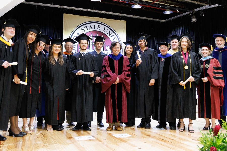 FSU Provost and Executive Vice President Jim Clark with the FSU-Panama Class of 2023 and members of the platform party following FSU-Panama's 2023 commencement ceremony Tuesday, Dec. 5, at the City of Knowledge Convention Center in Panama City, Panama. (FSU-Panama, Pedro Ahues) 