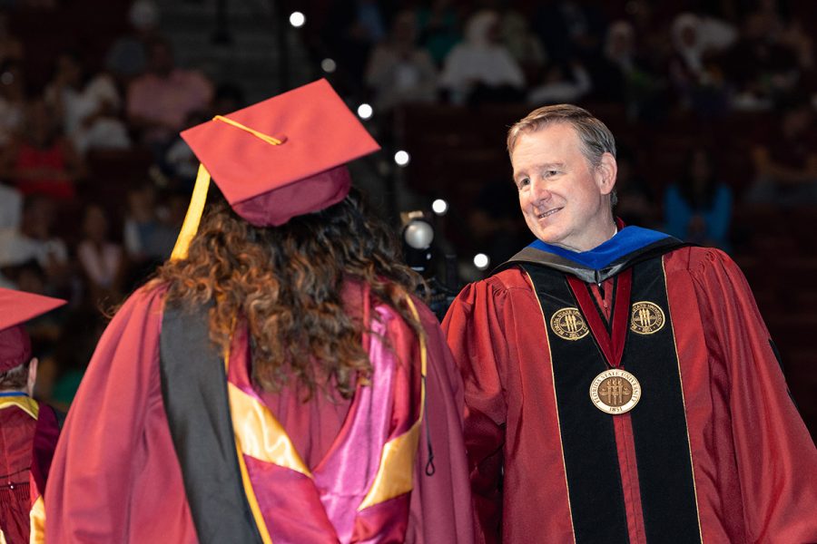Florida State University President Richard McCullough shakes hands with a graduate during one of the summer commencement ceremonies, Friday, Aug. 1, 2025, at the Donald L. Tucker Civic Center. (FSU Photography)
