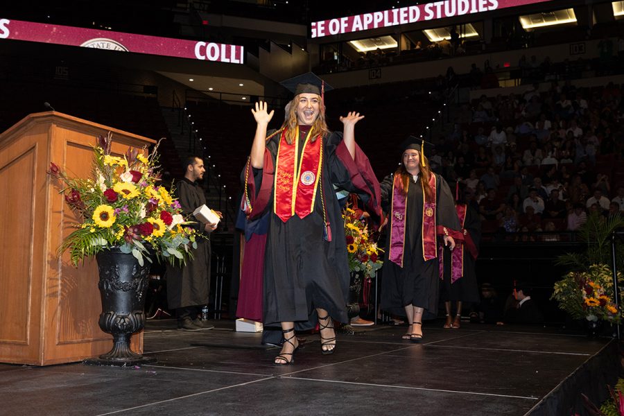 A Florida State University graduate celebrates during one of the summer ceremonies, Friday, Aug. 1, 2025, at the Donald L. Tucker Civic Center. (FSU Photography)