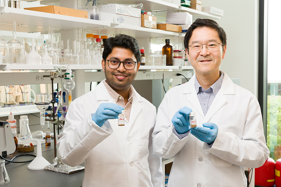 From left, Arijit Ghorai and Ho Yong Chung hold samples of lignin-based polyurethane. The research team used lignin and carbon dioxide to create a new kind of polyurethane that is biodegradable and doesn't contain toxic chemicals. (Scott Holstein/FAMU-FSU College of Engineering)