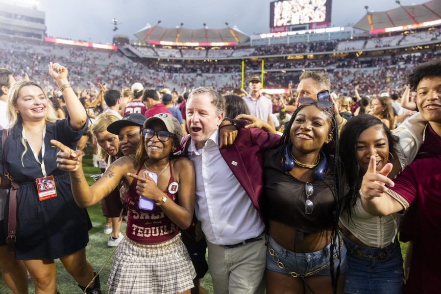 FSU President Richard McCullough celebrates with students on the field as the Florida State Seminoles defeat the Alabama Crimson Tide 31-17 at Doak Campbell Stadium on August 30, 2025. (Matthew McConnell/Florida State University)