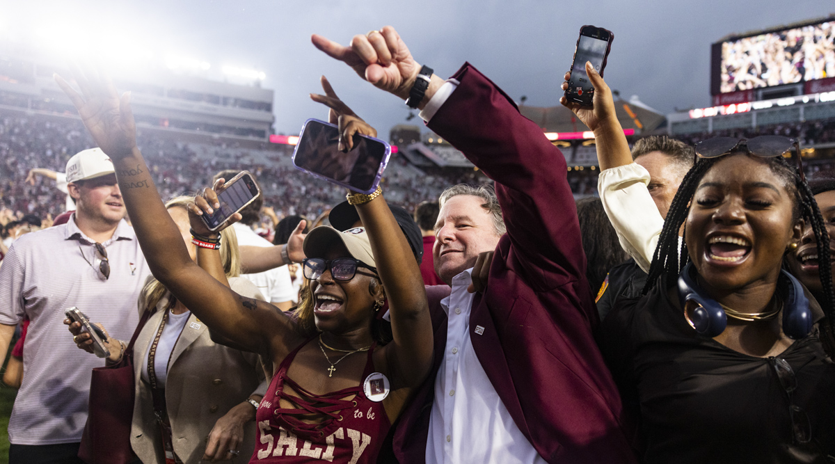 FSU President Richard McCullough celebrates with the team on the field as the Florida State Seminoles defeat the Alabama Crimson Tide 31-17 at Doak Campbell Stadium on August 30, 2025. (Matthew McConnell/Florida State University)