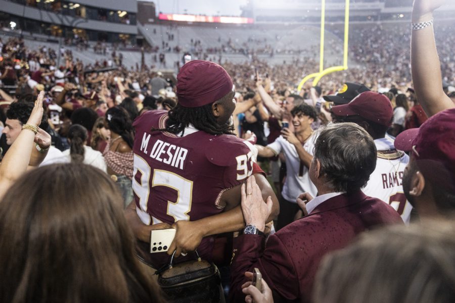 FSU defensive linemen Mandrell Desir celebrates with fans on the field after the Florida State Seminoles defeat the Alabama Crimson Tide 31-17 at Doak Campbell Stadium on August 30, 2025. (Matthew McConnell/Florida State University)