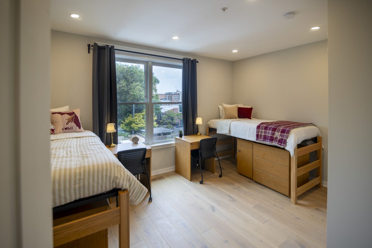 Bedroom from a student housing apartment, with two beds