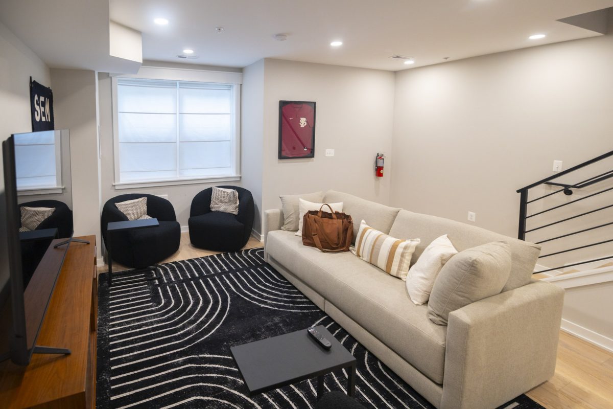 Living space of a student housing apartment with FSU paraphernalia (2/2)