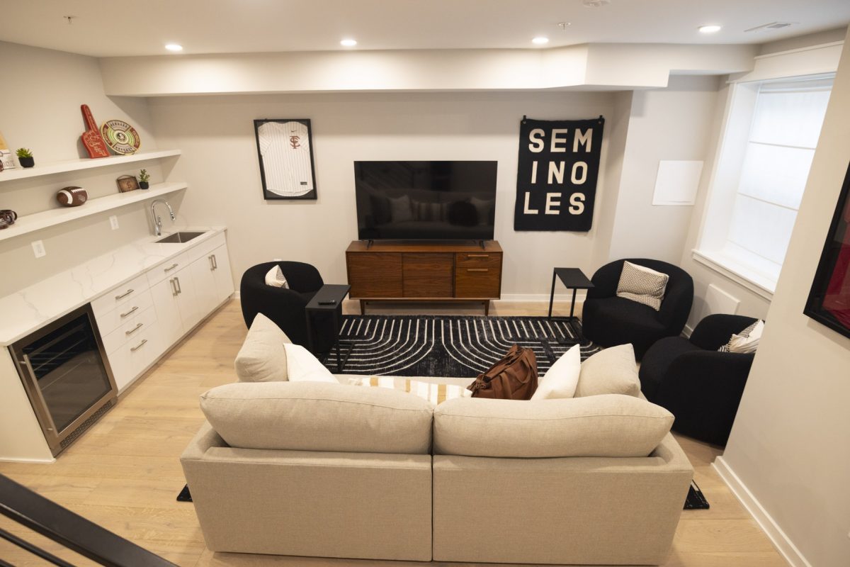 Living space of a student housing apartment with FSU paraphernalia (1/2)