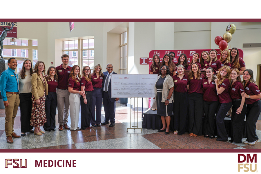 Dance Marathon at Florida State University (DM at FSU) student organizers present a check for $616,177.06 to the FSU College of Medicine for pediatric outreach programs. Since the FSU College of Medicine was added as a recipient of DM at FSU fundraising in 2003, the organization has contributed more than $10 million to the college. (Sofia Estavillo/FSU College of Medicine)