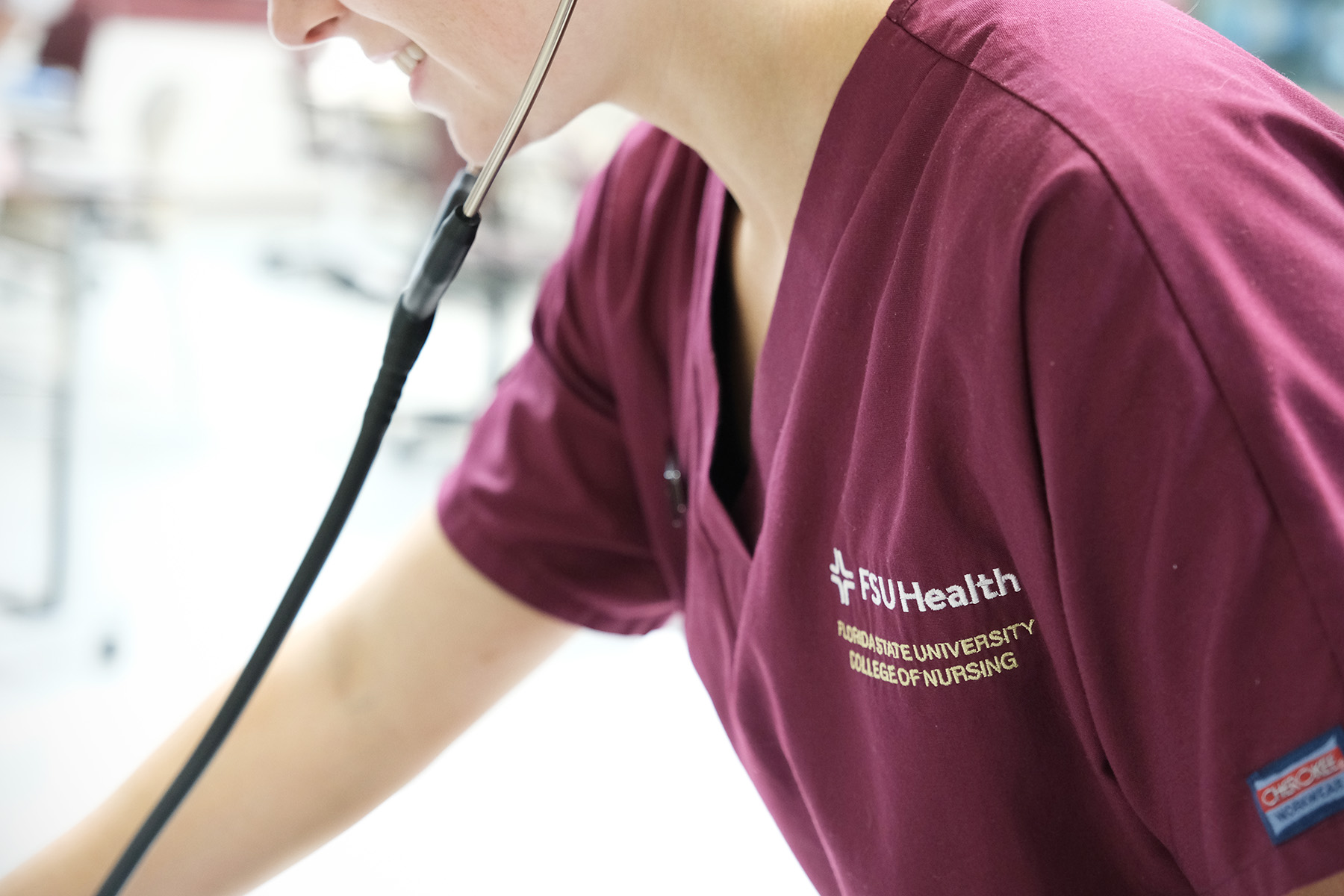 Close-up of a students FSU health scrubs