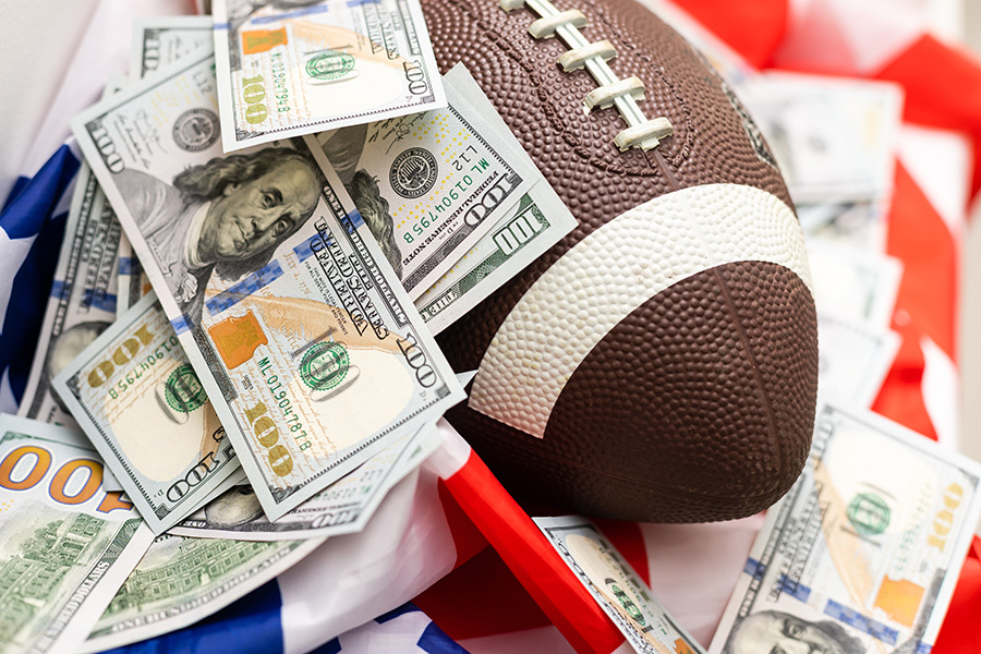 Close-up of money bills on a football