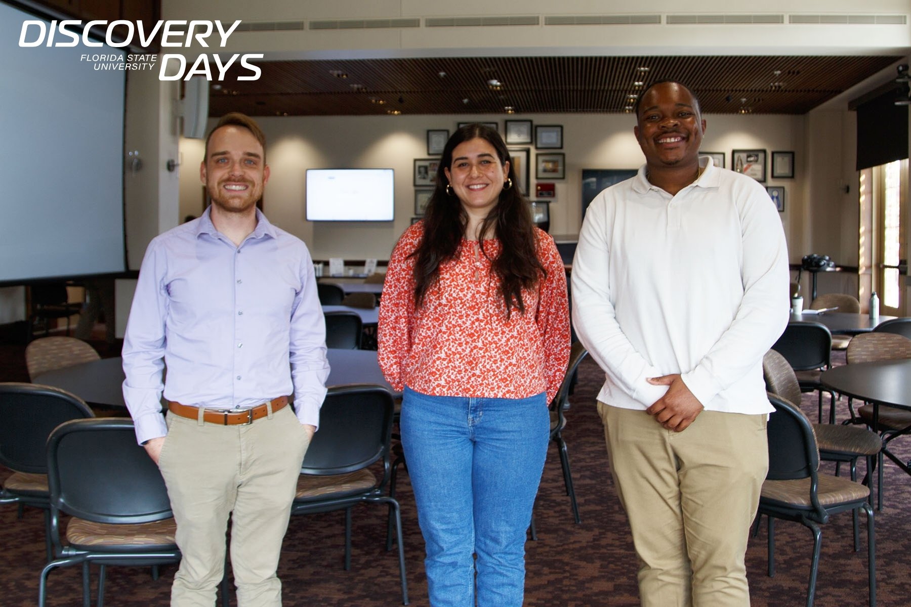 Three Doctoral students smiling, with discovery days graphic on the top left