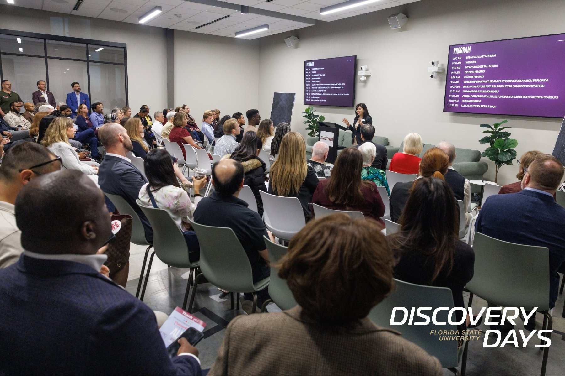 People sitting at FSU's IGNITE event with Discovery Days logo on the bottom right
