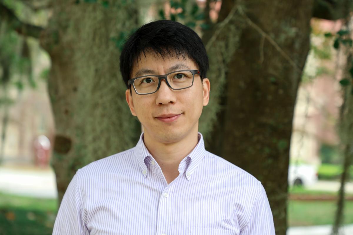 Professor of Physics Hanwei Gao stands outside on the Florida State University campus.