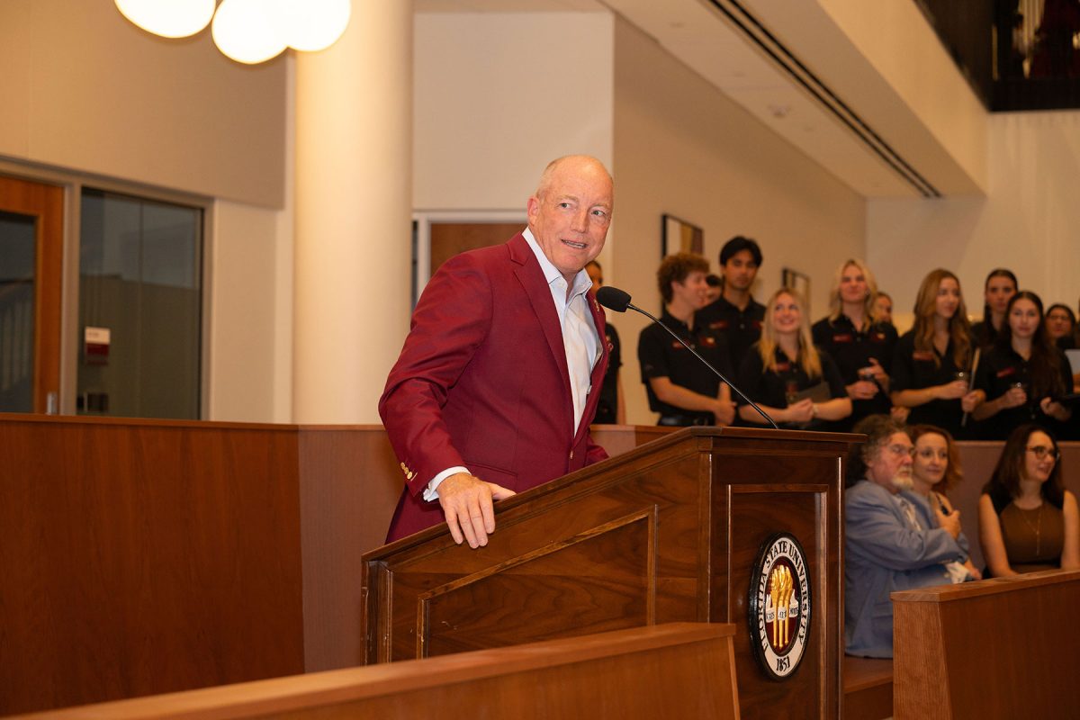 Peter Collins, a 2021 inductee into the College of Business Alumni Hall of Fame and the chair of the FSU Board of Trustees, speaks during the “Toast and Tour” event at Legacy Hall.