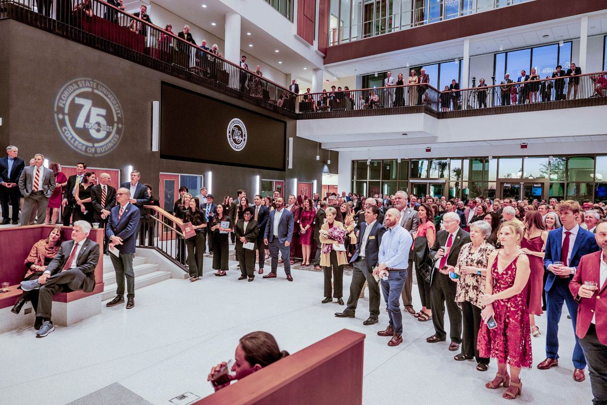 Guests fill the atrium and the first-floor balcony of Legacy Hall during the “Toast and Tour” event.