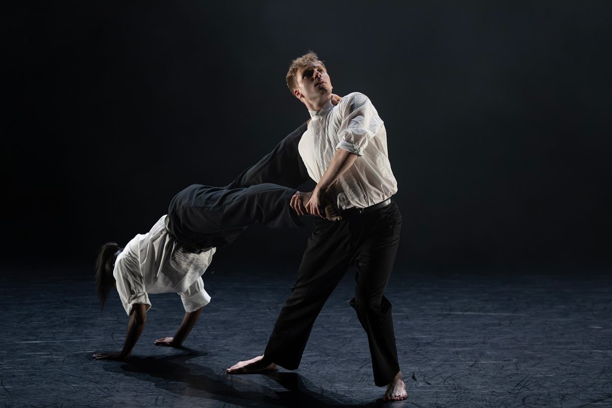 FSU School of Dance students Camille Pepper and Sam Hulkua perform “The One I Carry” onstage during the 2026 “Days of Dance,” with one dancer leaning backward as the other supports them.